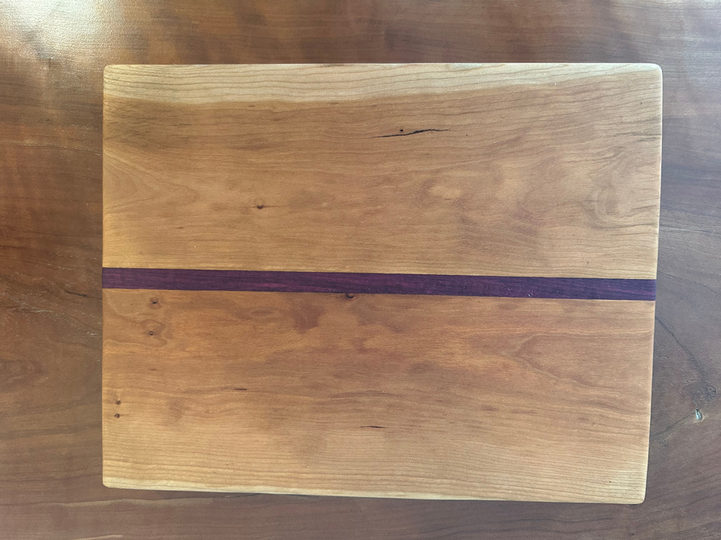 Purpleheart Squeezed Between Cherry Wood Cutting Board