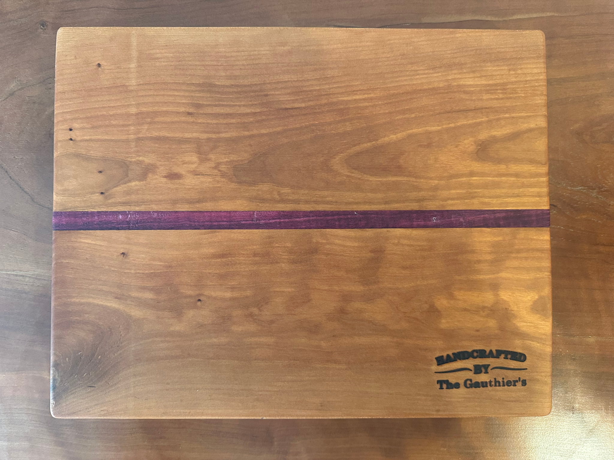 Purpleheart Squeezed Between Cherry Wood Cutting Board